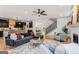 Open concept living room with modern furnishings flowing into the kitchen at 1055 Ormewood Se Ave, Atlanta, GA 30316