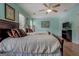 Bedroom features two queen beds with wood frames, carpet under area rug, and a ceiling fan at 500 Nicole Ct Se, Conyers, GA 30094