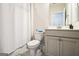 Neutral bathroom with a bathtub, shower curtain, and a vanity with a mirror at 2624 Caruso Way, Atlanta, GA 30339