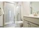 Bright bathroom featuring a tiled glass shower, modern sink, and neutral color palette at 2624 Caruso Way, Atlanta, GA 30339