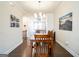 Elegant dining room with a wooden table set, hardwood floors, and stylish artwork, perfect for gatherings at 2624 Caruso Way, Atlanta, GA 30339