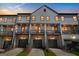 Townhome with garages and balconies showing exterior details and driveways at 2624 Caruso Way, Atlanta, GA 30339