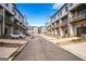 Attractive street view featuring modern townhomes, private garages, and well-maintained landscaping at 2624 Caruso Way, Atlanta, GA 30339