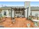 Relaxing back deck area featuring a covered pergola, swing, and inviting outdoor space at 40 Berkshire Run, Covington, GA 30016