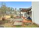 Inviting back deck with a cozy swing and garden area, perfect for outdoor relaxation and entertaining at 40 Berkshire Run, Covington, GA 30016