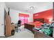 Bedroom features a wooden bed frame, desk, and red accent wall at 40 Berkshire Run, Covington, GA 30016