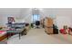 Bonus room featuring a daybed, desk, aquarium, and cardboard boxes at 40 Berkshire Run, Covington, GA 30016