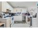 Bright kitchen with white cabinets, stainless steel appliances, and ample countertop space at 40 Berkshire Run, Covington, GA 30016