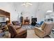 Cozy living room featuring a brick fireplace, vaulted ceilings, and comfortable seating at 40 Berkshire Run, Covington, GA 30016