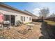Paved backyard patio, perfect for entertaining, with views of the home's exterior at 7764 Parkside Dr, Lithia Springs, GA 30122