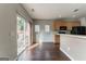 Bright kitchen with stainless steel appliances, wood cabinets, breakfast bar, and sliding glass door at 7764 Parkside Dr, Lithia Springs, GA 30122