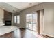 Cozy living area featuring a fireplace, windows and sliding door access to the outdoor patio at 7764 Parkside Dr, Lithia Springs, GA 30122
