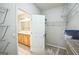 Walk-in closet with shelving and convenient access to the bathroom at 7764 Parkside Dr, Lithia Springs, GA 30122