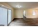 Bright living room with wood-look flooring and a sliding glass door at 2060 Sanders Dr, Austell, GA 30168