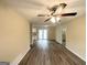 Spacious living room featuring wood-look flooring, neutral paint, and sliding glass doors at 2060 Sanders Dr, Austell, GA 30168