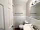 This bathroom features ceramic tiled walls and a large vanity and mirror at 29 Hickory Ct, Dallas, GA 30157