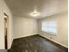 Bedroom featuring dark wood floors and a large window at 29 Hickory Ct, Dallas, GA 30157