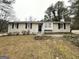 Single-story home featuring a front entrance, multiple windows, and landscaping at 29 Hickory Ct, Dallas, GA 30157