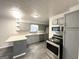 Well-lit kitchen featuring stainless steel appliances and granite countertops at 29 Hickory Ct, Dallas, GA 30157