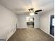 Inviting living room with carpet floors and a view into the kitchen at 29 Hickory Ct, Dallas, GA 30157