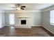 Spacious living room featuring light gray walls and a brick fireplace at 29 Hickory Ct, Dallas, GA 30157