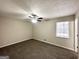 Neutral bedroom with plush carpeting, ceiling fan, and natural light at 2846 Cocklebur Rd, Decatur, GA 30034