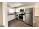 Modern kitchen with stainless steel appliances, granite countertops, and white cabinets at 2846 Cocklebur Rd, Decatur, GA 30034