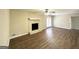 Inviting living room with a stone fireplace and modern ceiling fan at 2846 Cocklebur Rd, Decatur, GA 30034