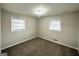 Inviting bedroom with neutral walls, carpet, and large windows at 3647 Brookcrest Cir, Decatur, GA 30032