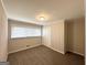 Cozy bedroom with neutral walls, carpet, and a double door closet at 3647 Brookcrest Cir, Decatur, GA 30032