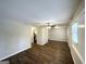 Open living room with a ceiling fan, neutral paint, and modern flooring leading to an adjoining kitchen at 3647 Brookcrest Cir, Decatur, GA 30032