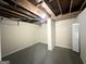 Unfinished basement featuring exposed ceiling, painted walls, and ample space for customization at 4568 Dorset Cir, Decatur, GA 30035