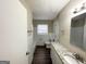 Updated bathroom featuring a granite vanity and tiled floors at 4568 Dorset Cir, Decatur, GA 30035