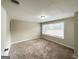 Comfortable bedroom featuring plush carpeting, neutral paint, and a bright window with blinds at 4568 Dorset Cir, Decatur, GA 30035