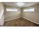 Simple bedroom with carpeted floors, large windows, and neutral walls at 1785 San Gabriel Ave, Decatur, GA 30032
