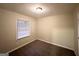 Cozy bedroom with neutral carpeting and a bright window at 191 Florida Sw Ave, Atlanta, GA 30310