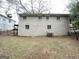 A view of the home's backyard featuring a grass lawn at 1986 Bandera Dr, Decatur, GA 30032
