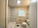 Bathroom featuring granite countertops, and a tiled shower-bath combination at 1986 Bandera Dr, Decatur, GA 30032