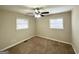 Bedroom featuring neutral carpet, fresh paint, a ceiling fan and two windows offering natural light at 1986 Bandera Dr, Decatur, GA 30032