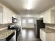 Kitchen featuring stainless steel appliances, stone countertops, and sleek white cabinets at 1986 Bandera Dr, Decatur, GA 30032