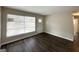 Living room featuring fresh paint, wood flooring, and a window providing ample natural light at 1986 Bandera Dr, Decatur, GA 30032