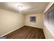 Cozy bedroom with wood flooring, neutral walls, and a bright window at 320 Brooks Sw Ave, Atlanta, GA 30310
