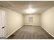 Spacious bedroom with soft carpet, neutral walls, and natural light from a window at 320 Brooks Sw Ave, Atlanta, GA 30310