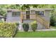 Charming brick home featuring a welcoming front porch with wooden railing and well-maintained landscaping at 320 Brooks Sw Ave, Atlanta, GA 30310
