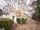 Charming brick home featuring a front porch with a red door and well-maintained landscaping at 320 Brooks Sw Ave, Atlanta, GA 30310
