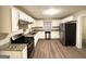 Modern kitchen featuring white cabinets, stainless steel appliances, and stylish countertops at 320 Brooks Sw Ave, Atlanta, GA 30310