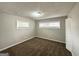 Bedroom features neutral carpet and walls, two windows at 3415 Homera Pl, Decatur, GA 30032