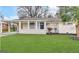 Charming single story home with a well-manicured green lawn and inviting front porch at 3415 Homera Pl, Decatur, GA 30032
