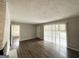 Living Room features hardwood floors, access to exterior and painted brick fireplace at 3415 Homera Pl, Decatur, GA 30032