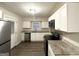 Updated kitchen with granite countertops and stainless steel appliances at 648 Ozburn Nw Rd, Atlanta, GA 30318